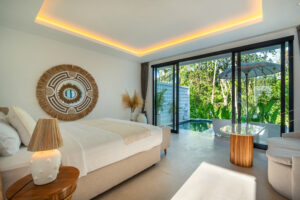 a bedroom with a bed and a large window at edvin m